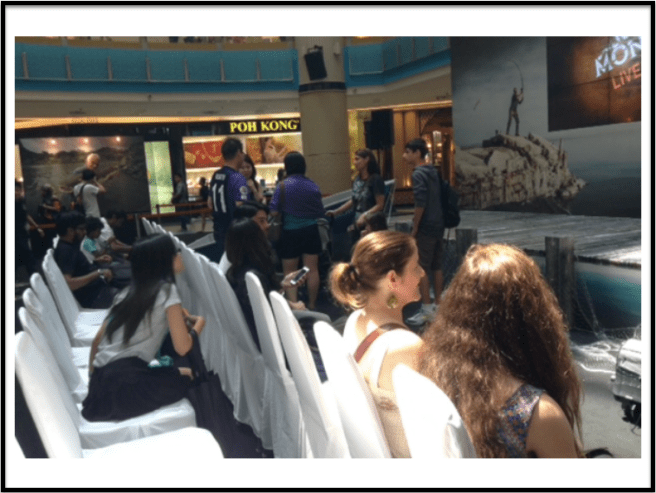 VIP Pass holders who thoughts the seats were for them too. Pass holders in the background being asked to stand behind instead.