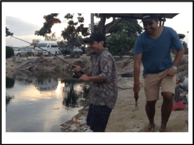 Happy to fish, despite being surrounded by trash from irresponsible fishermen