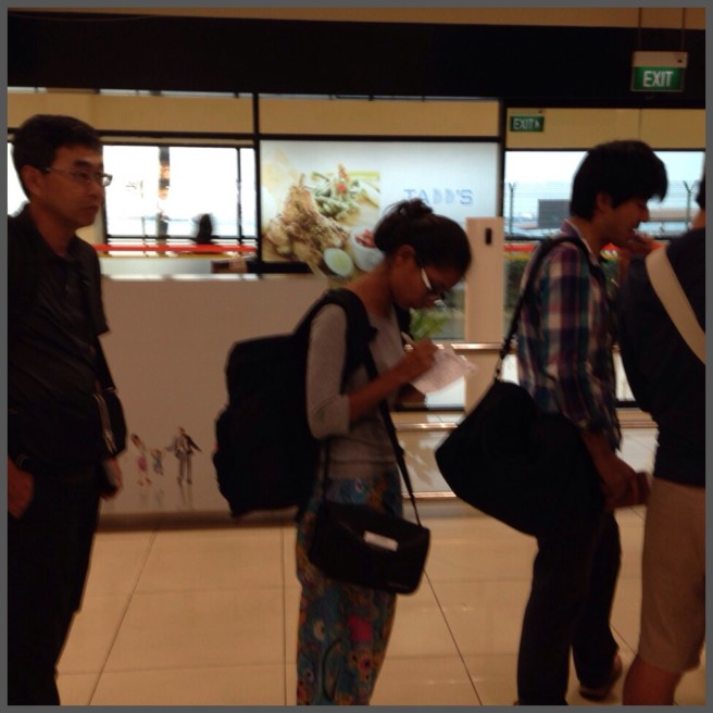 Filling out our embarkation cards before boarding.